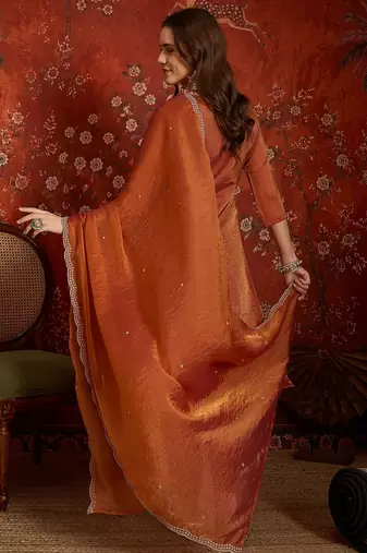 Rust color smart and ethnic silk fabric embroidered partywear suit