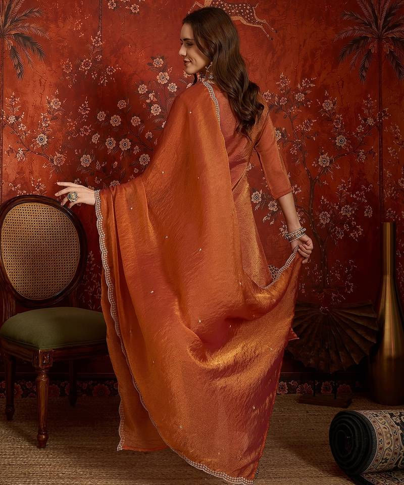Rust color smart and ethnic silk fabric embroidered partywear suit