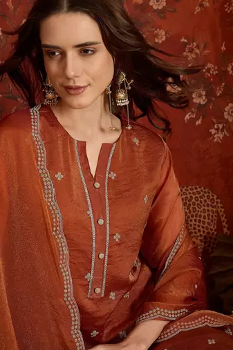 Rust color smart and ethnic silk fabric embroidered partywear suit
