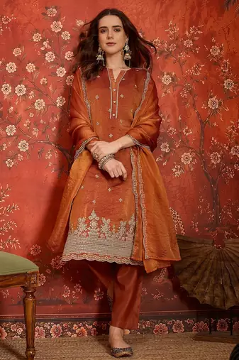 Rust color smart and ethnic silk fabric embroidered partywear suit