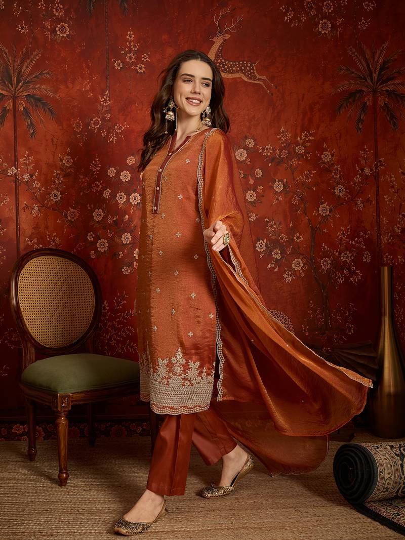 Rust color smart and ethnic silk fabric embroidered partywear suit