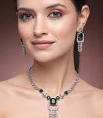 green necklace set with matching earrings for women