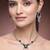 green necklace set with matching earrings for women