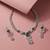 green necklace set with matching earrings for women