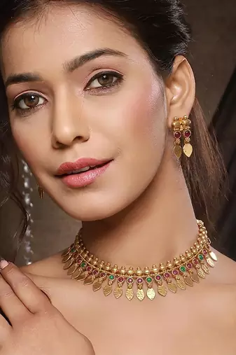 Gold plated temple necklace set with multicolor stones and matching earrings