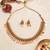 Gold plated temple necklace set with multicolor stones and matching earrings