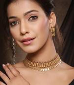 Gold plated temple necklace set with multicolor stones and matching earrings