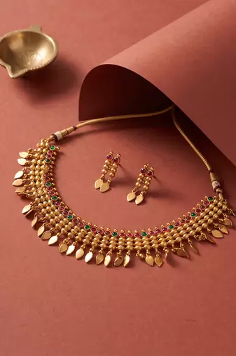 Gold plated temple necklace set with multicolor stones and matching earrings