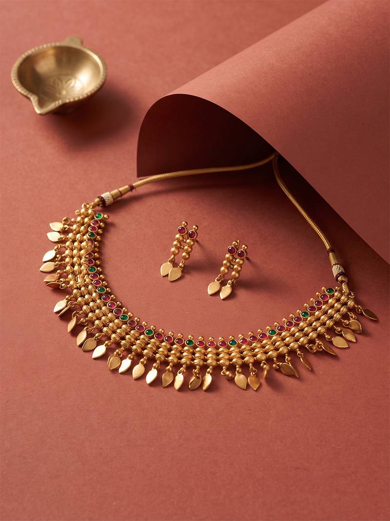 Gold plated temple necklace set with multicolor stones and matching earrings