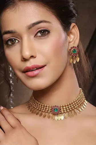 Gold plated temple necklace set with multicolor stones and matching earrings