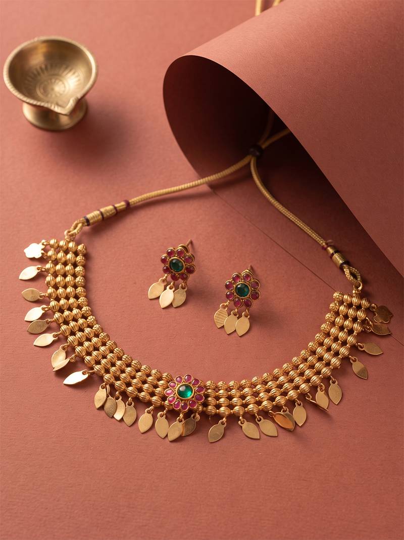 Gold plated temple necklace set with multicolor stones and matching earrings