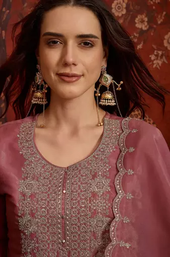 Pink color smart and ethnic silk fabric embroidered partywear suit