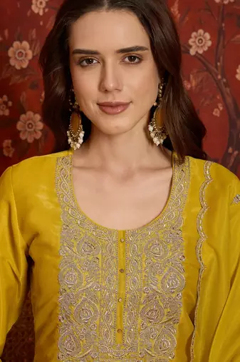 Yellow color smart and ethnic silk fabric embroidered partywear suit