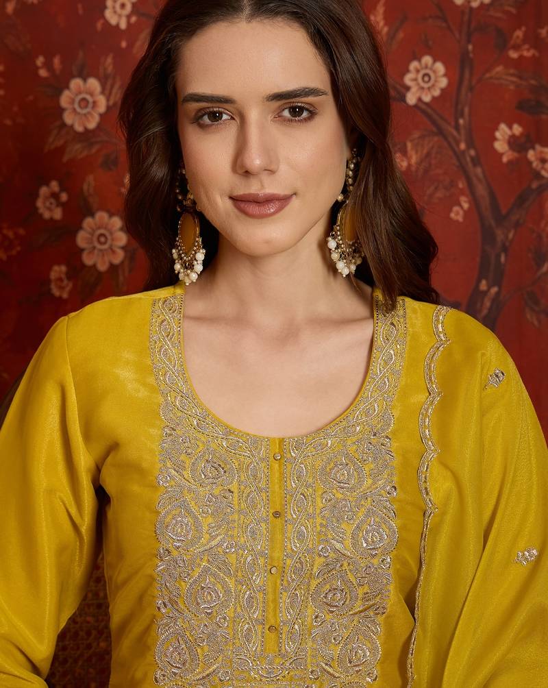 Yellow color smart and ethnic silk fabric embroidered partywear suit