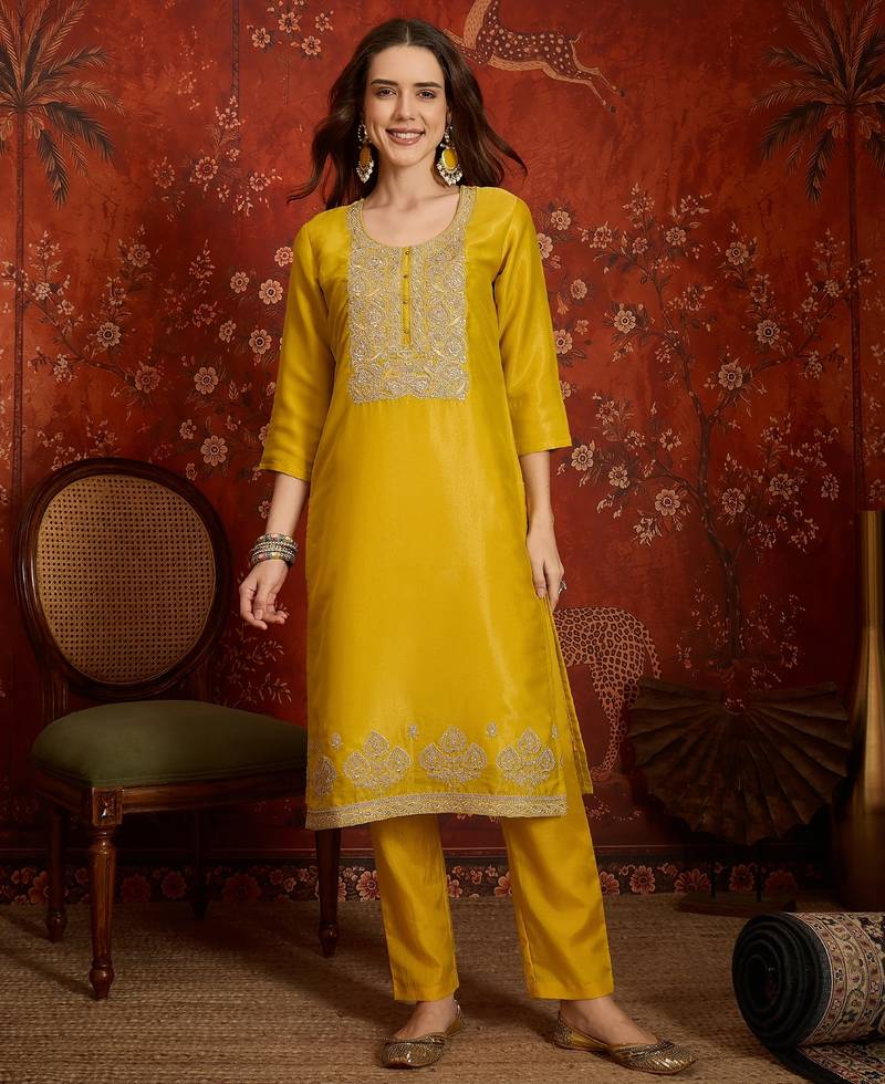 Yellow color smart and ethnic silk fabric embroidered partywear suit