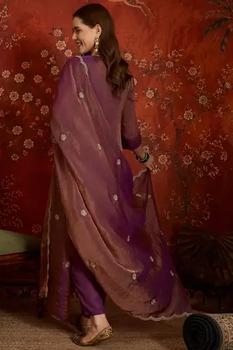 Purple color smart and ethnic silk fabric embroidered partywear suit