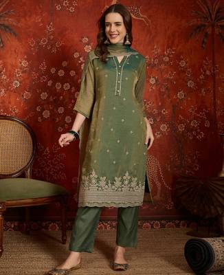 Green color smart and ethnic silk fabric embroidered partywear suit 1