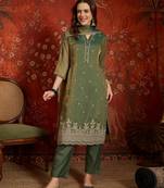 Green color smart and ethnic silk fabric embroidered partywear suit