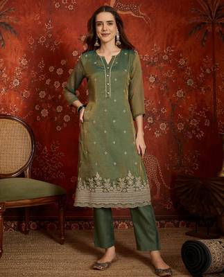 Green color smart and ethnic silk fabric embroidered partywear suit 4