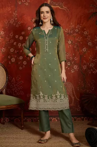 Green color smart and ethnic silk fabric embroidered partywear suit