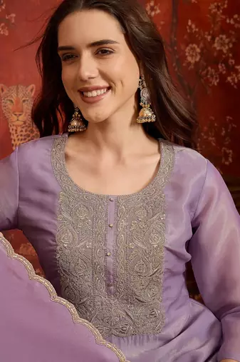 Purple color smart and ethnic silk fabric embroidered partywear suit