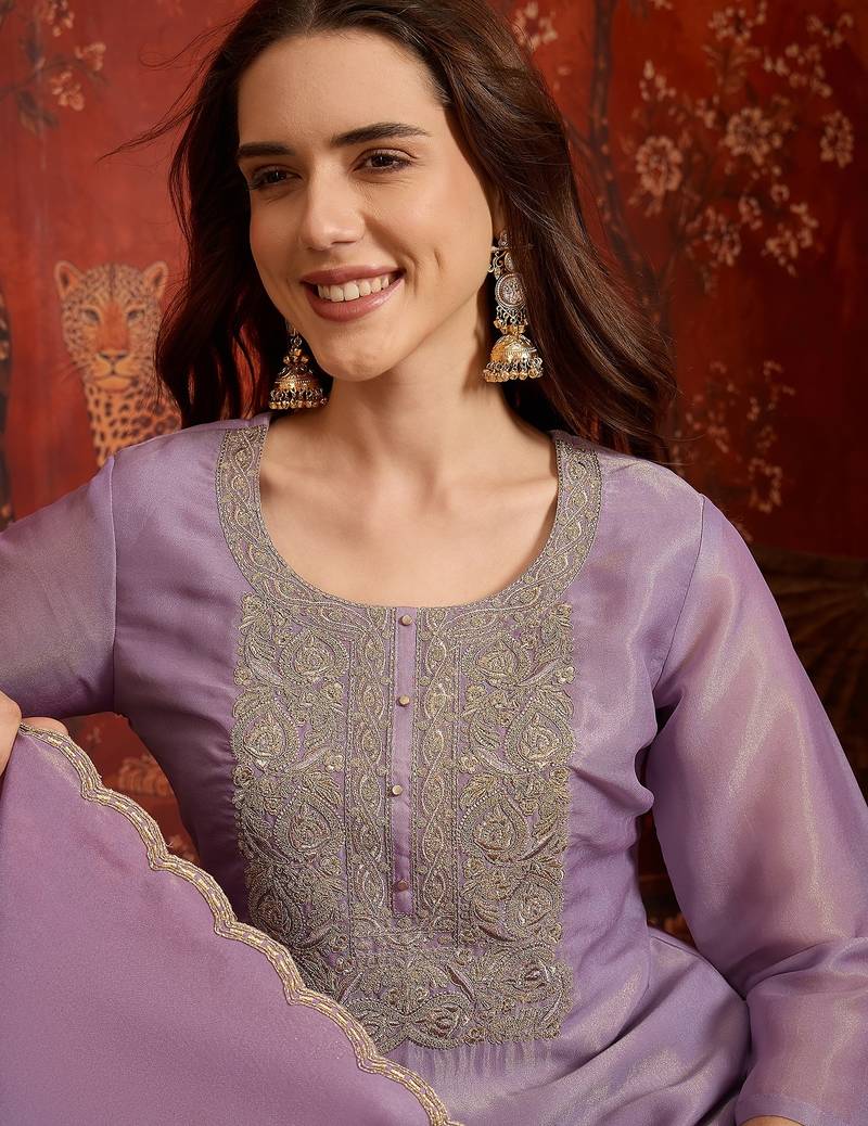 Purple color smart and ethnic silk fabric embroidered partywear suit