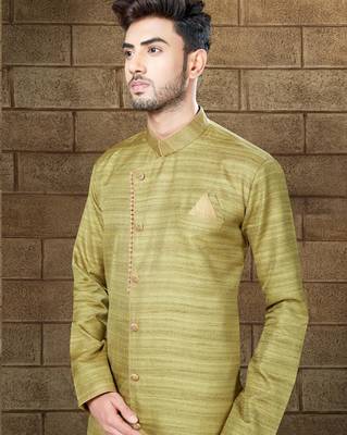 Olive-green indo-western sherwani with an asymmetrical placket—ideal for weddings. 2