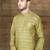 Olive-green indo-western sherwani with an asymmetrical placket—ideal for weddings.