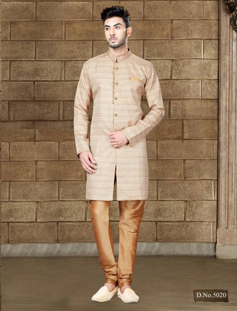 Beige textured sherwani with gold buttons and matching pocket square—perfect for weddings.