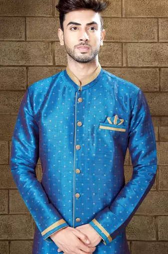 Royal-blue sherwani with gold accents and matching pocket square—ideal for celebrations.