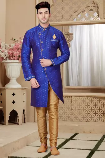 Royal-blue sherwani with gold motifs, asymmetrical front,—perfect for celebrations.