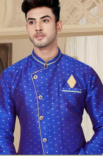 Royal-blue sherwani with gold motifs, asymmetrical front,—perfect for celebrations.