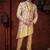 Cream floral sherwani with asymmetrical jacket, gold accents—ideal for weddings.