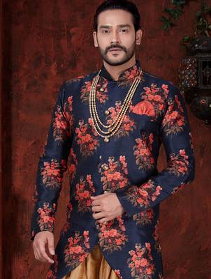 Navy blue floral sherwani with asymmetrical hem, pearl necklace, and gold trousers. 2