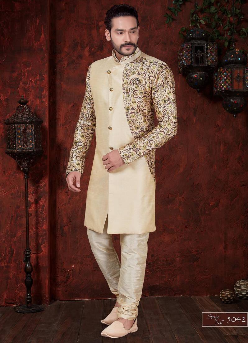 Fawn sherwani with floral sleeves, gold buttons, and matching trousers—ideal for weddings.