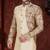 Fawn sherwani with floral sleeves, gold buttons, and matching trousers—ideal for weddings.