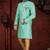 Mint-green patterned sherwani with teal trim, embellished pocket square, and gold trousers.