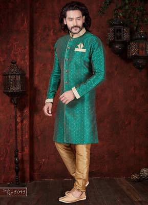 Green sherwani with gold motifs, contrast trim, and matching pocket square. 1