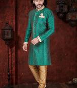 Green sherwani with gold motifs, contrast trim, and matching pocket square.