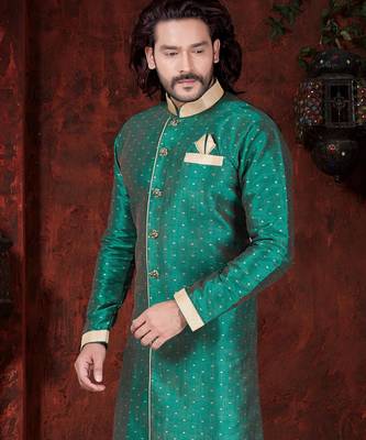 Green sherwani with gold motifs, contrast trim, and matching pocket square. 2