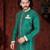 Green sherwani with gold motifs, contrast trim, and matching pocket square.