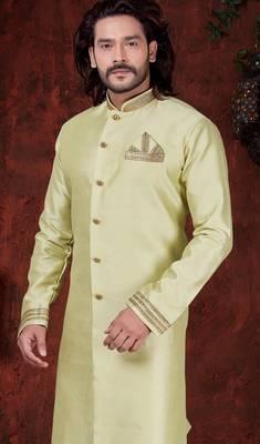 Light pistachio sherwani with gold-trimmed cuffs and collar, ornate buttons,& pocket square. 2