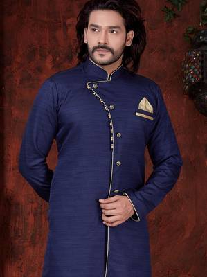 Navy-blue sherwani with asymmetrical placket, gold pocket square, and gold trousers. 2