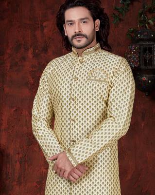 Fawn sherwani with gold motifs, matching pocket square, and gold trousers—ideal for weddings. 2