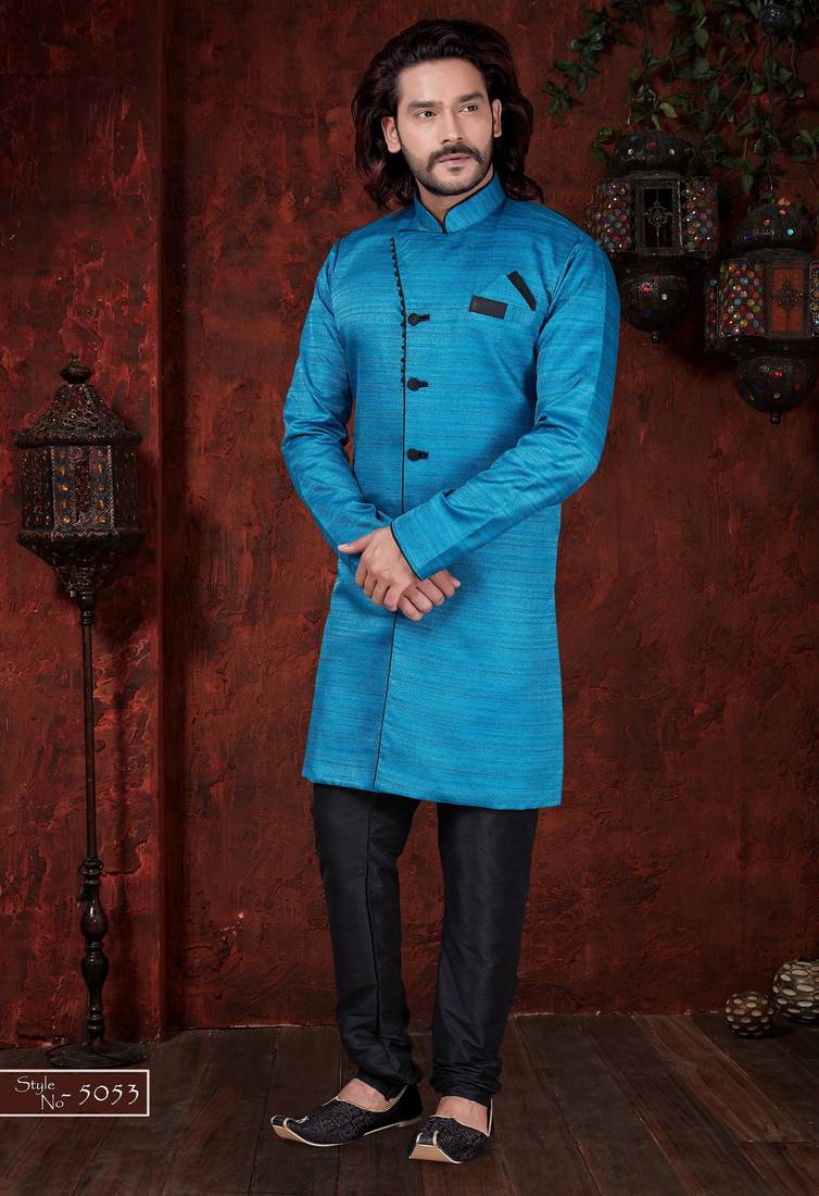 Turquoise sherwani with textured finish, black accents, and black trousers.