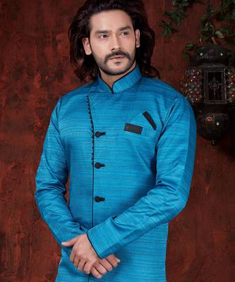 Turquoise sherwani with textured finish, black accents, and black trousers. 2