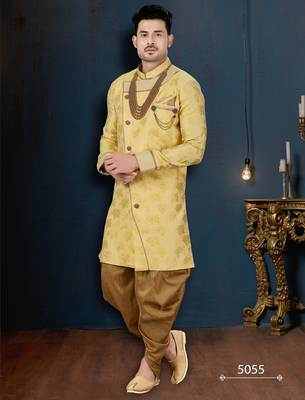Mustard floral sherwani with pearl accessories, embellished pocket, and gold trousers. 1
