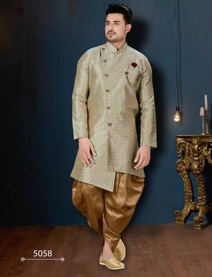 Blue-and-gold patterned sherwani with ornate buttons, burgundy pocket,with gold trousers. 1