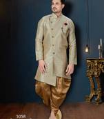 Blue-and-gold patterned sherwani with ornate buttons, burgundy pocket,with gold trousers.