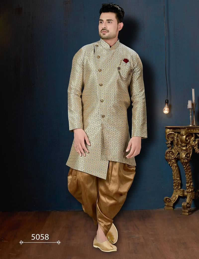 Blue-and-gold patterned sherwani with ornate buttons, burgundy pocket,with gold trousers.